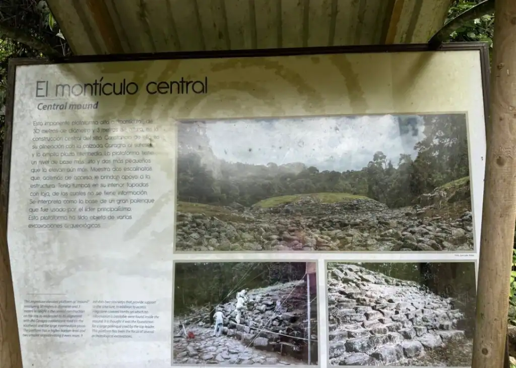 Informational sign at Guayabo National Monument in Turrialba, Costa Rica, describing the Central Mound with historical details and photos of the stone structure and archaeological excavations.